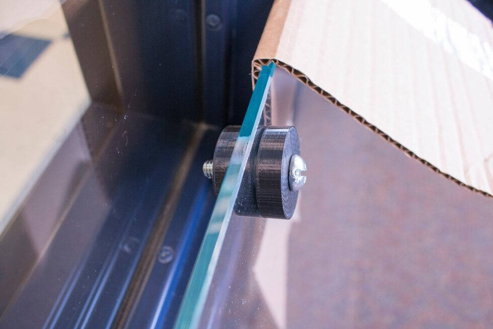 Rubber standoffs attached to a glass panel